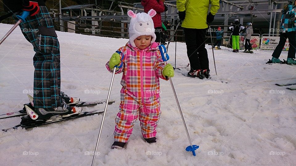 Small girl on the snow