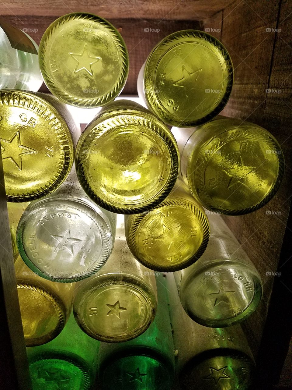 backlit old wine bottles