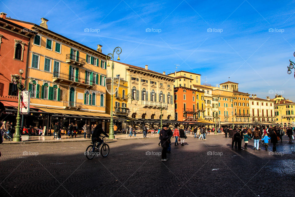 Different grades of orange and yellow color buildings in Verona City.
