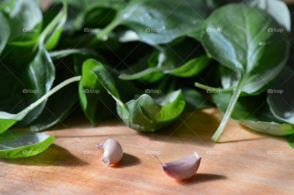 Basil and garlic on cutting board