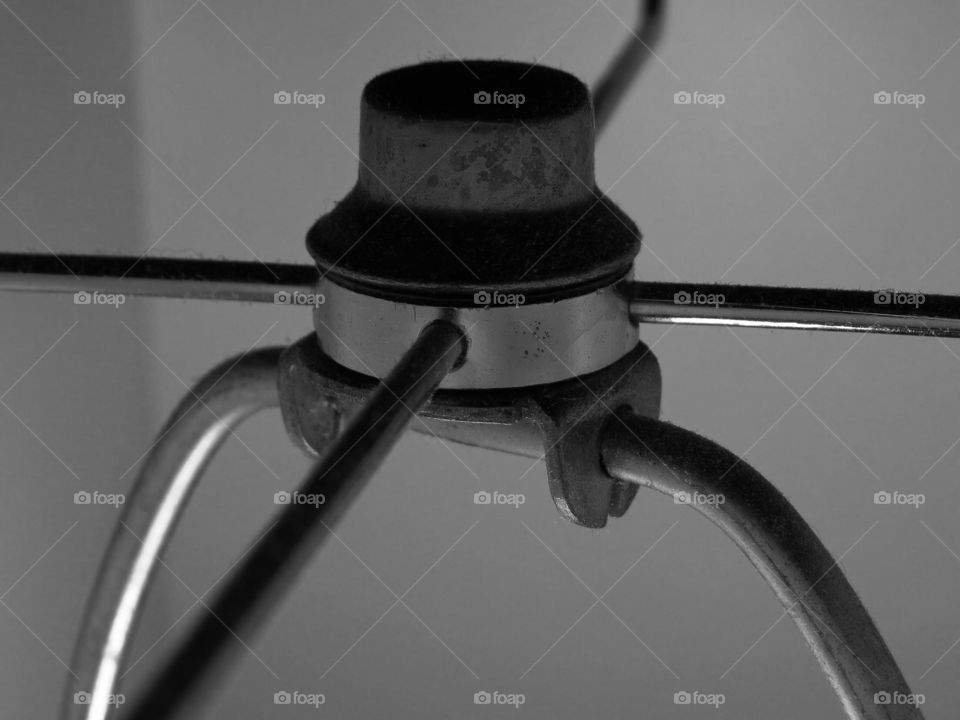 Black and white photo, part of a lamp.