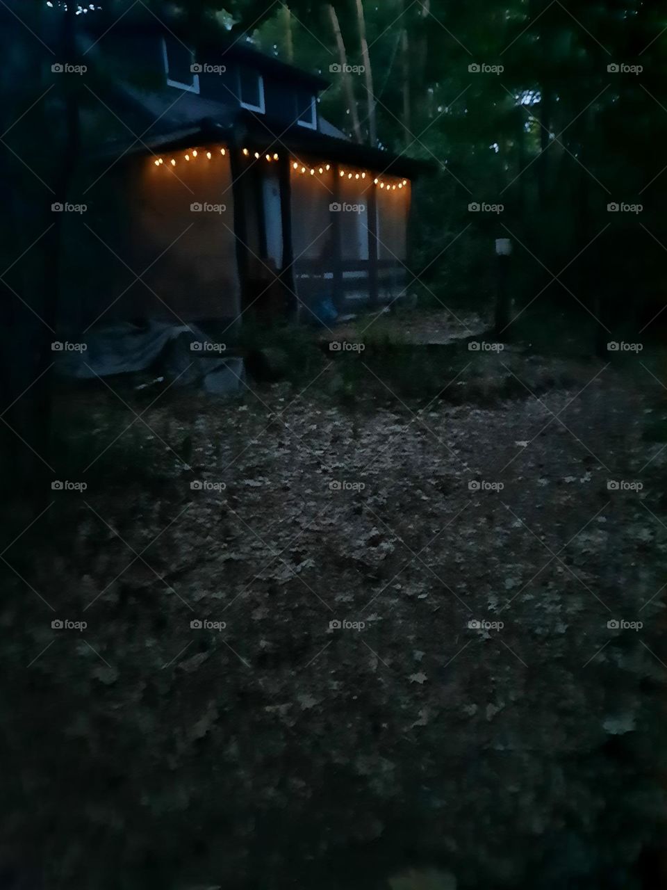 Led lamps on wooden terrace at night