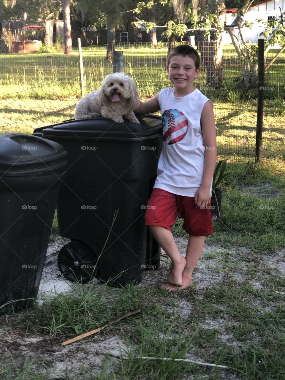 My son happy with his dog sassy what a team they are so cute and sweet adolescence.