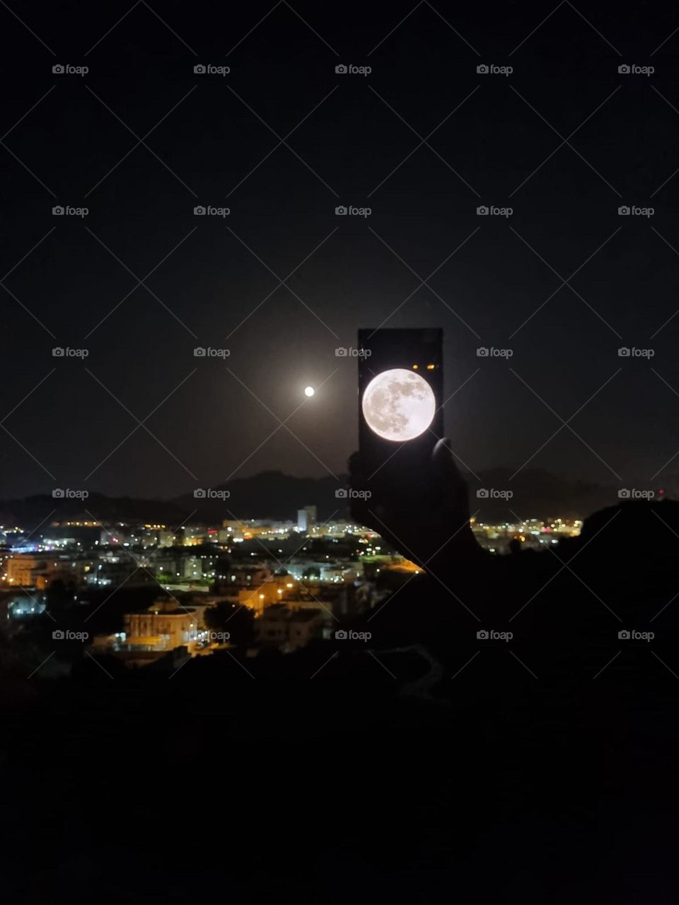 captured a moon light night view of muscat