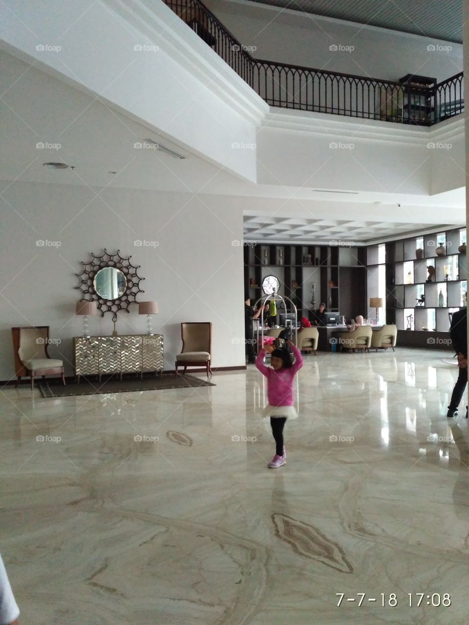 Dancing and spinning on the spacious room waiting for the bellboy to come xD