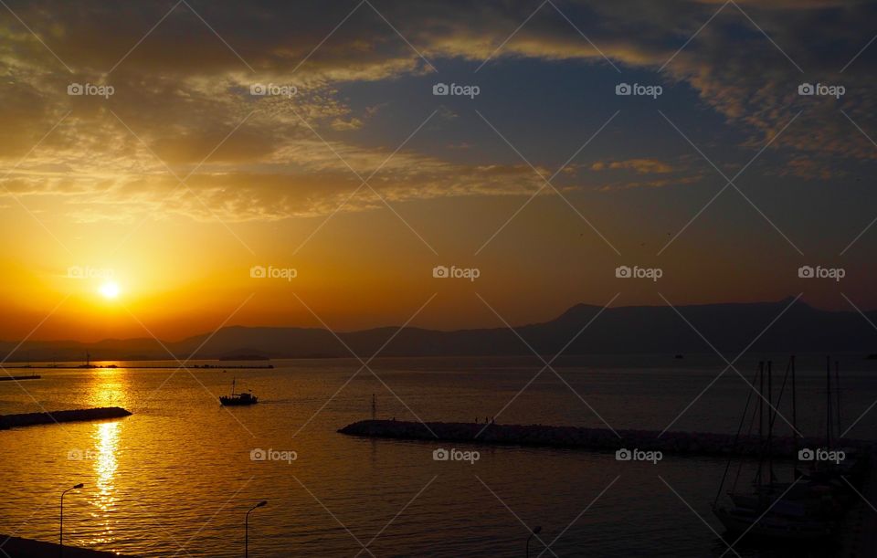 Deep sunset over Corfu Town Old Harbour, Greece