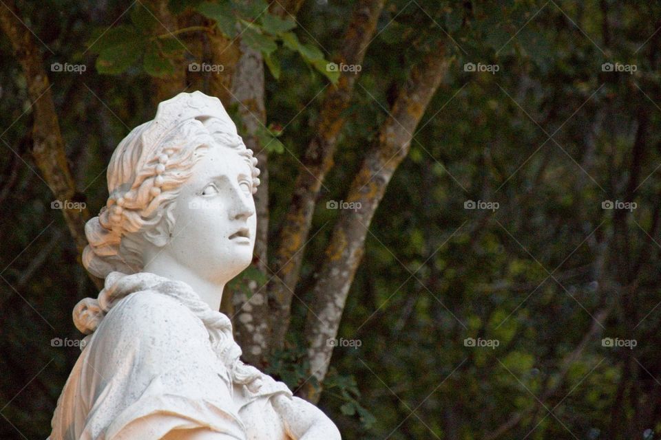 statue of a person in a garden