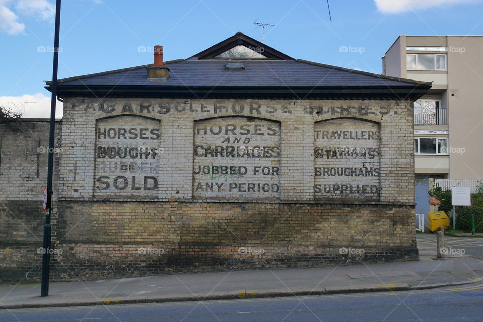 Text on brick wall of building