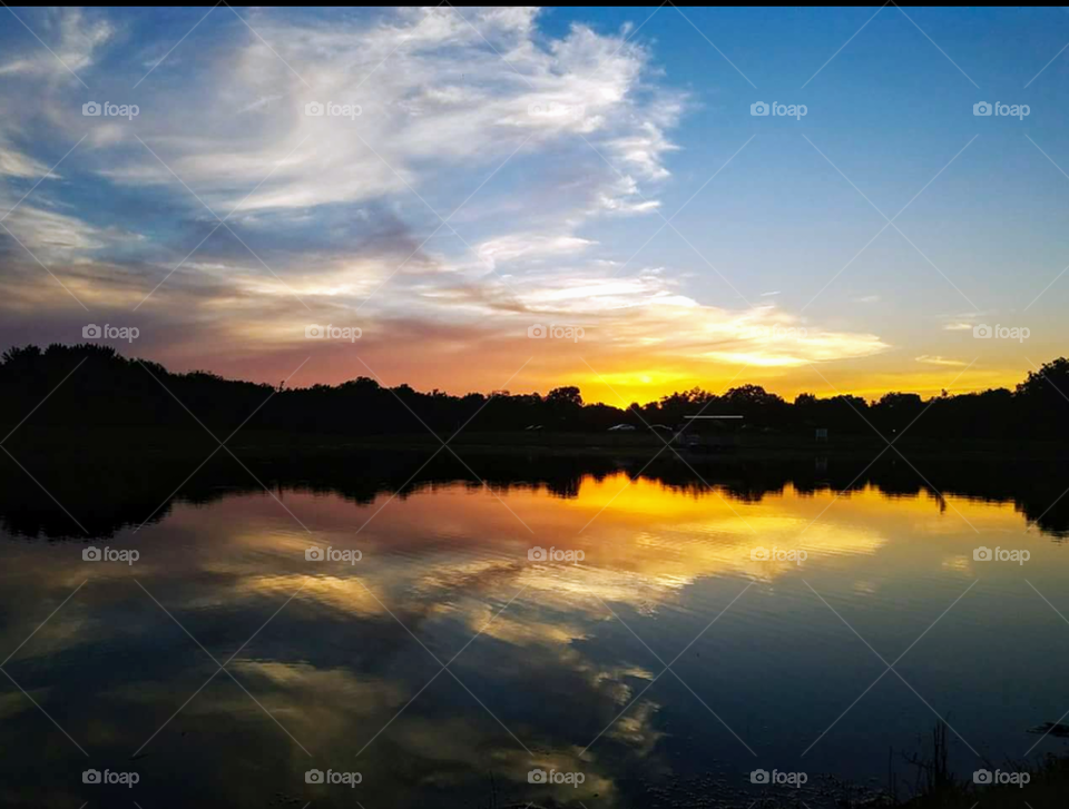 Landscape with sunset colored sky