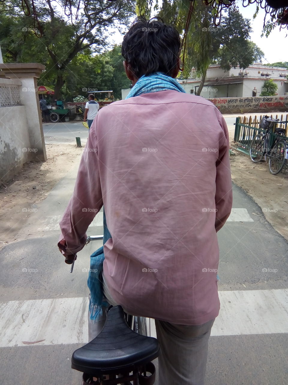 a rickshaw puller pulling the rickshaw