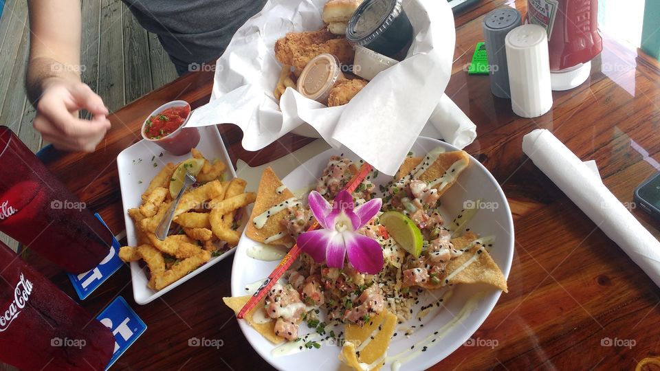 Delicious food. Calamari, nachos, nuggets , chicken fingers flower. decoration