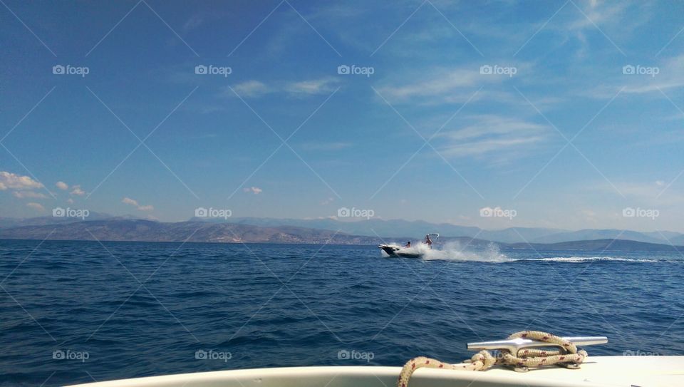 speeding speedboat . on Nasaki beach in corfu