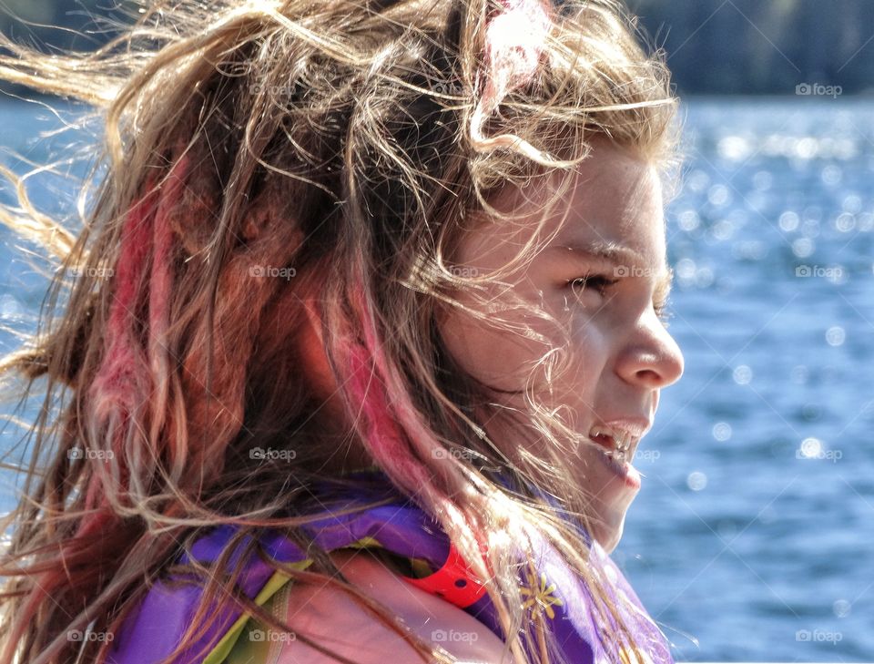 Young Girl In The Golden Hour. Young Girl With Pink Dreadlocks During The Golden Hour
