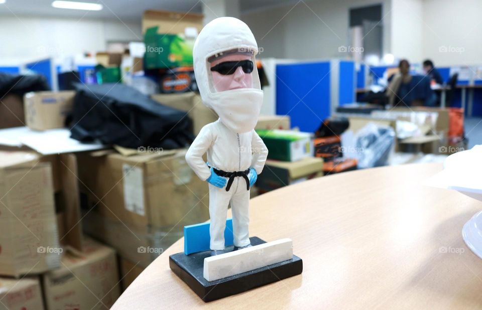 Stuffed cute toy shaped like a statue and white