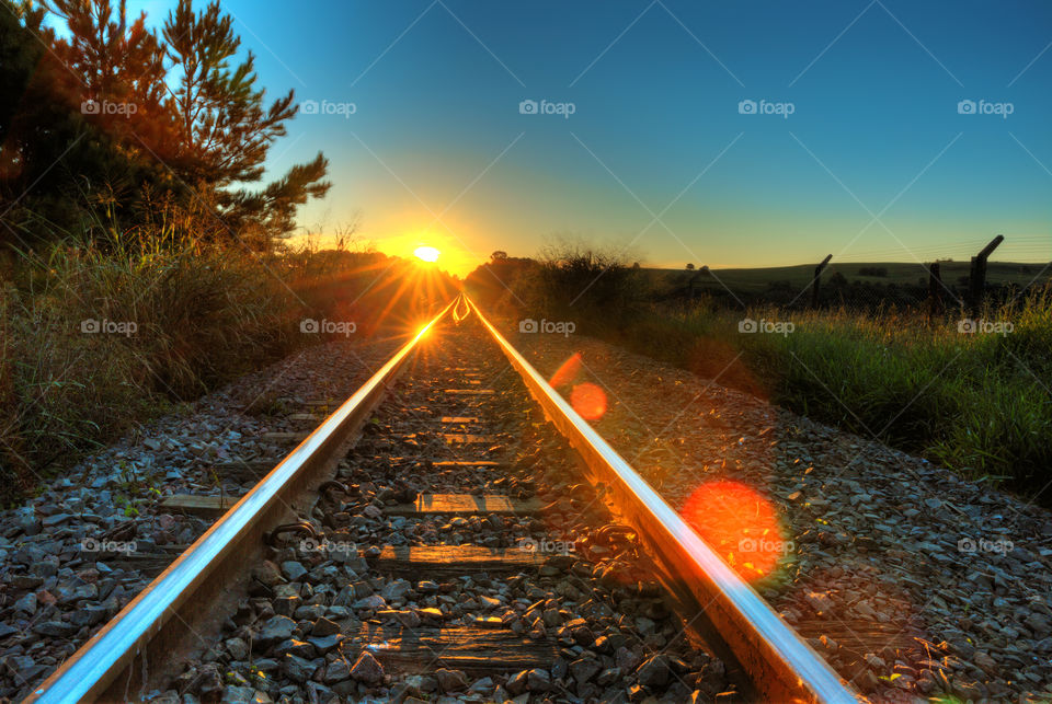 Sunset on train rail.