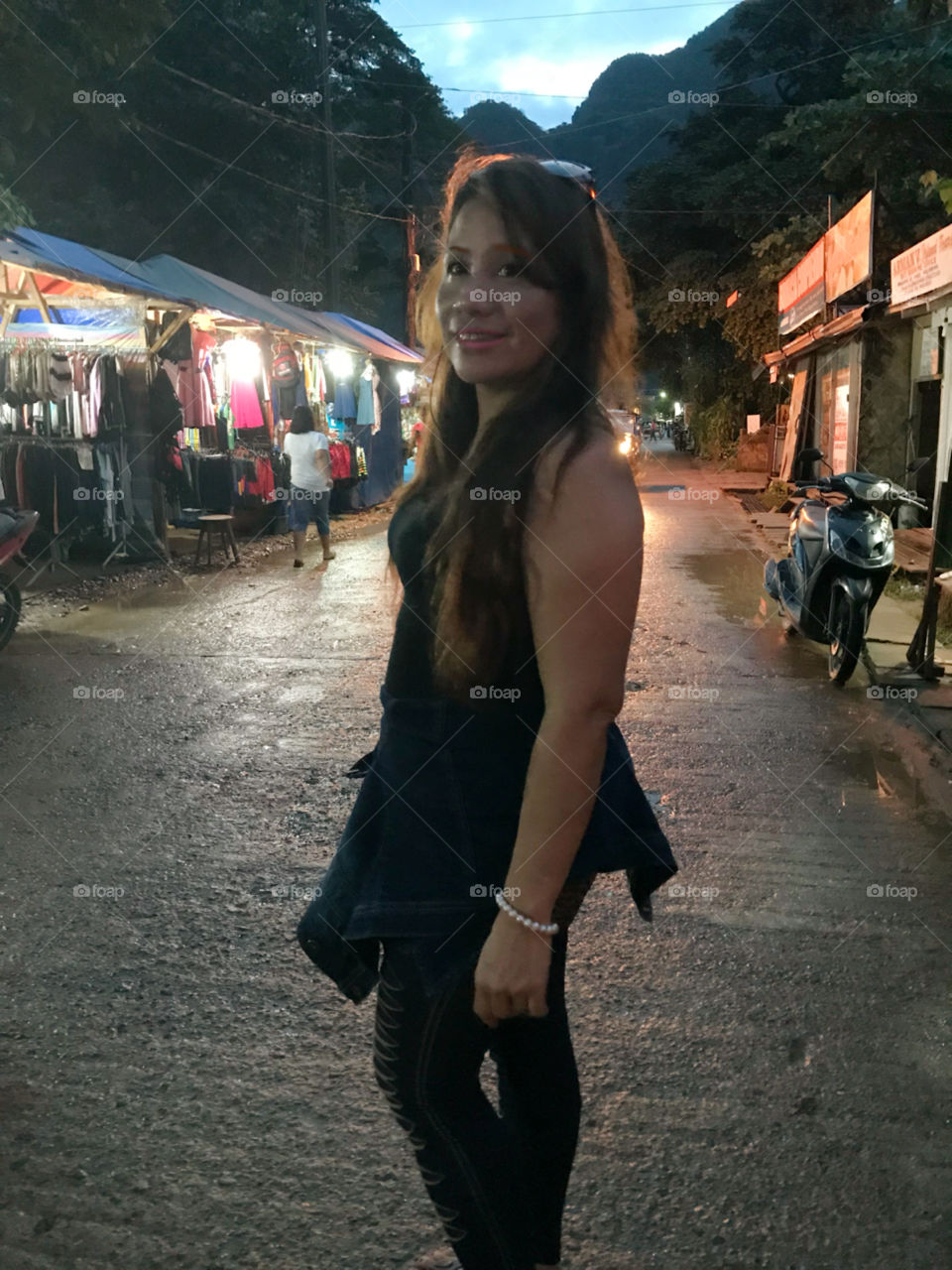 Walking on the street at night with smile on face