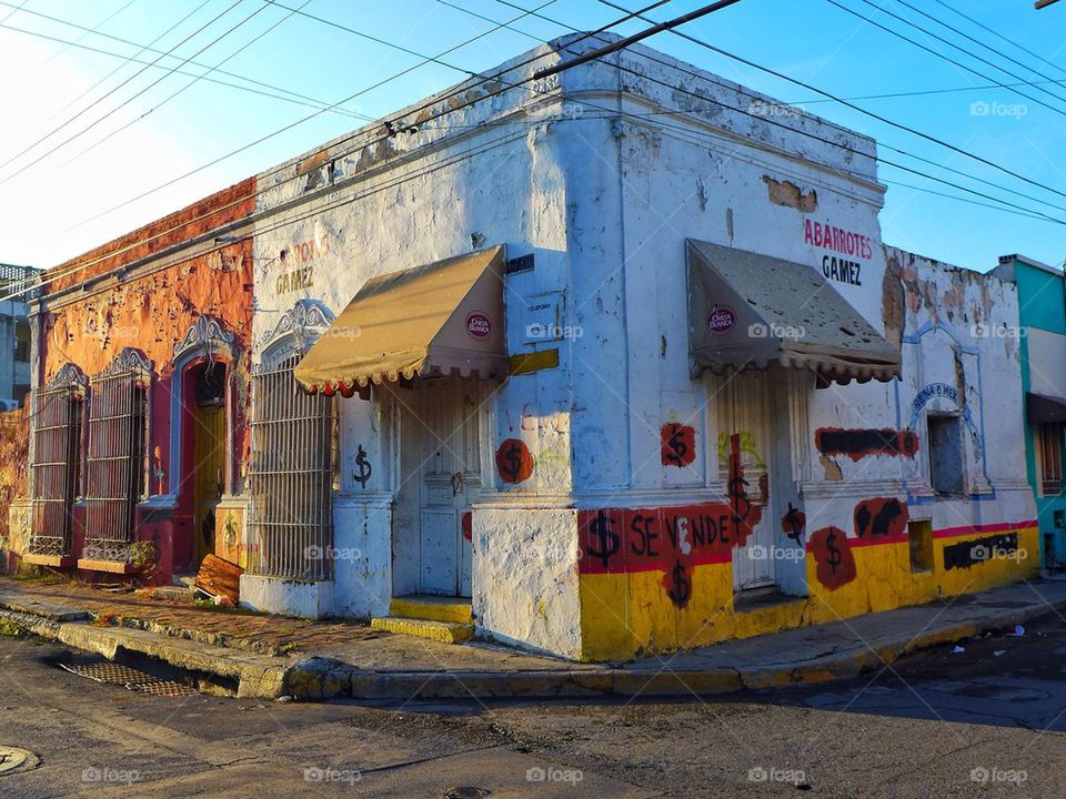 Old mexican downtown pueblo corner stone closed for sale.