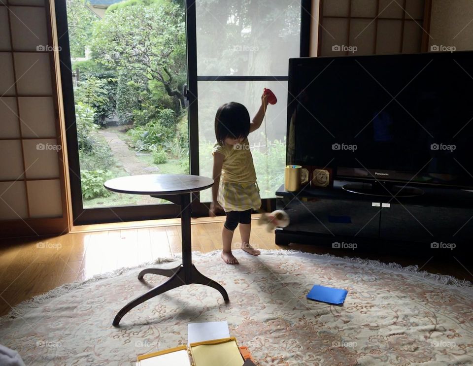 Little playing by the window