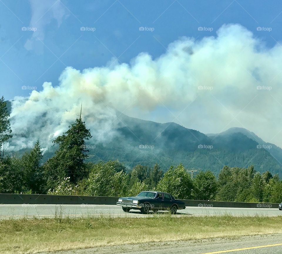 Smoky forest fire rages in the hills of British Columbia, Canada 
