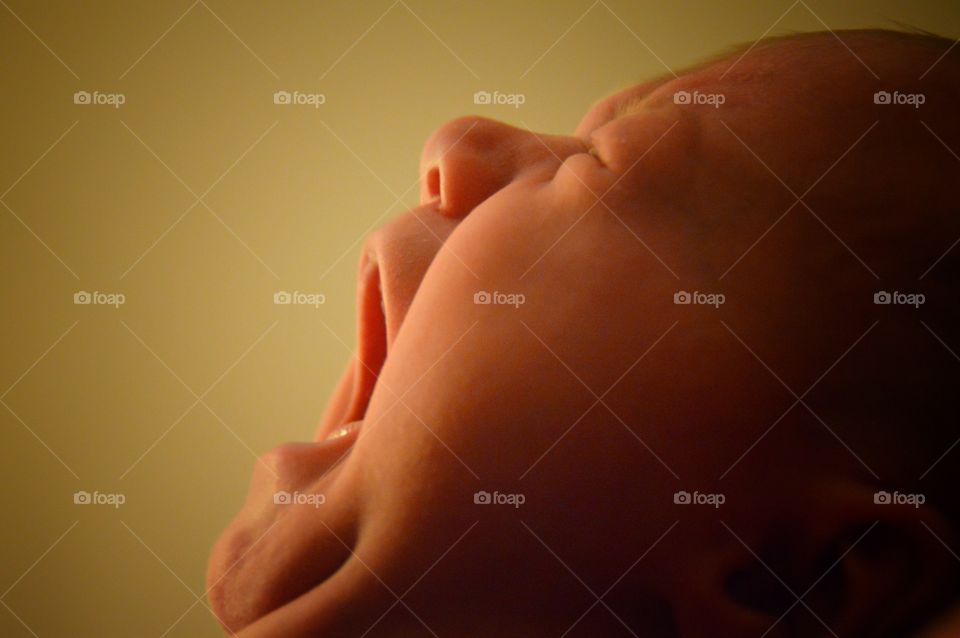 Close-up of a beautiful crying baby girl.