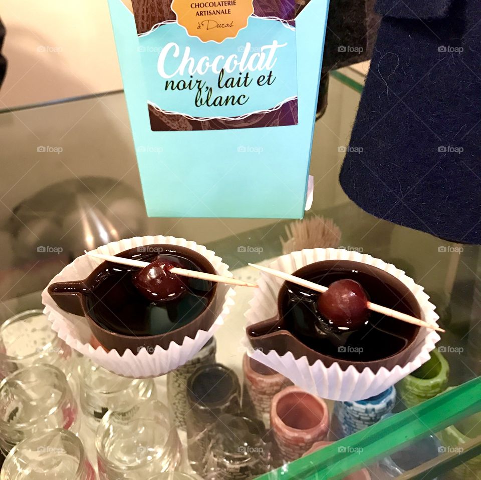 A cherry liqueur served in dark chocolate cups