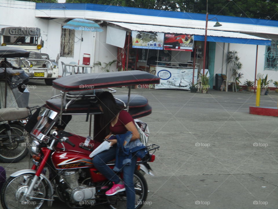 girl on tricycle