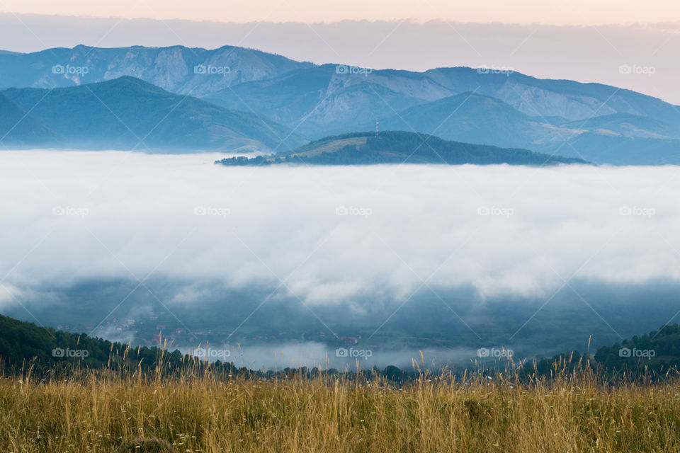 View of mountain in foggy weather