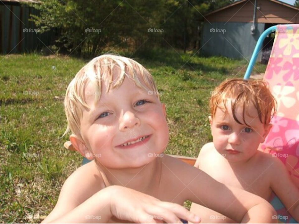 My boys after a day of splashing in the water hose! 