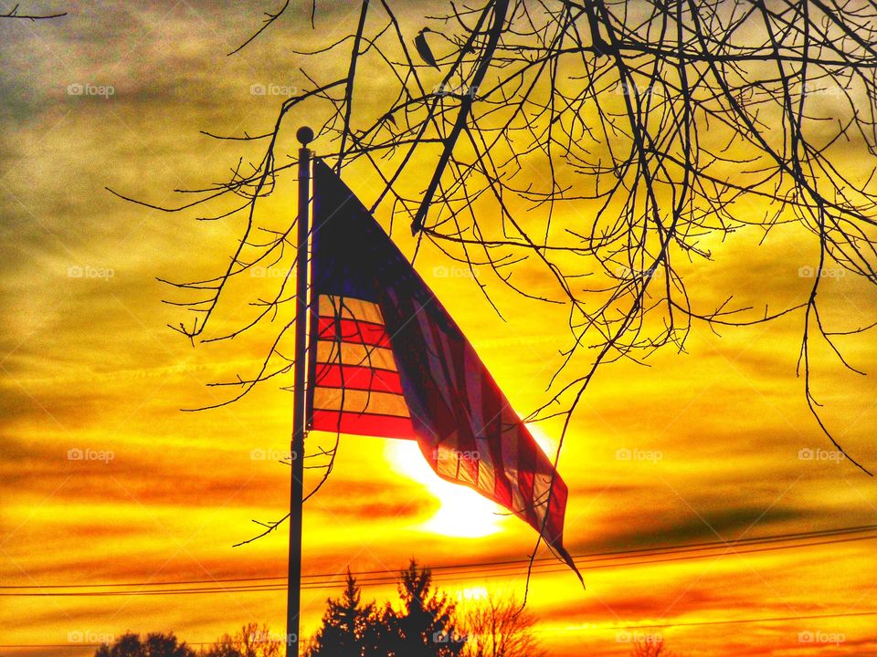 Sunset behind the flag