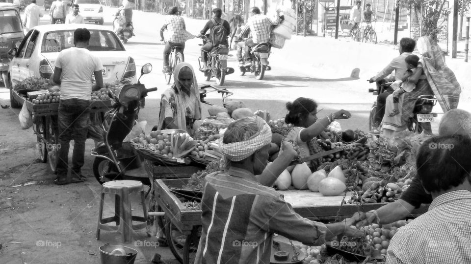 Nostalgic features of vegetarians running their street shops on the main road in Baranas/India ...