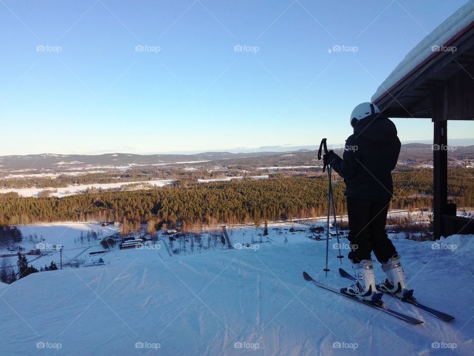 Skiier on top of mountain at skiresort