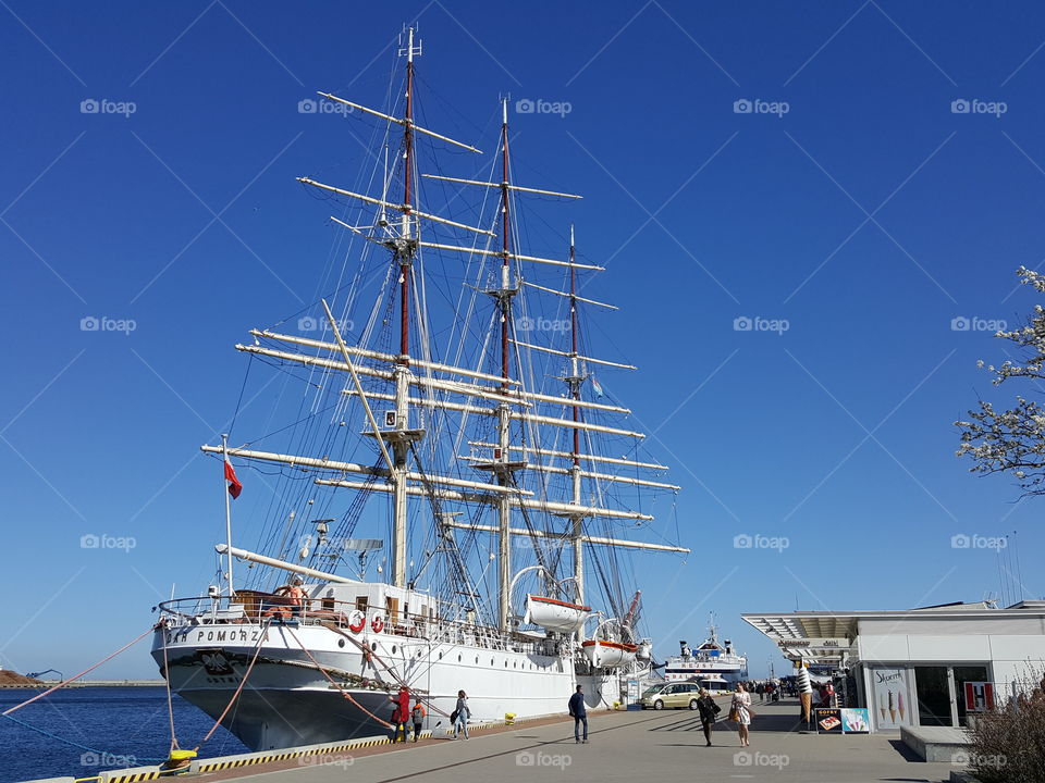 Historic sailing ship Dar Pomorza moored on the quay in Gdynia on a sunny clear day