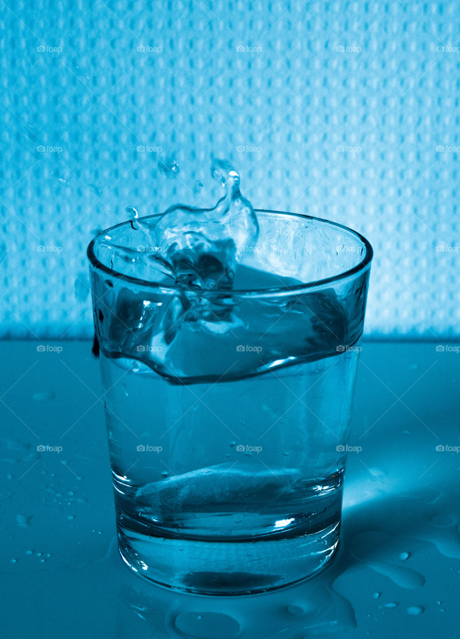 Cup with water, blue, transparent