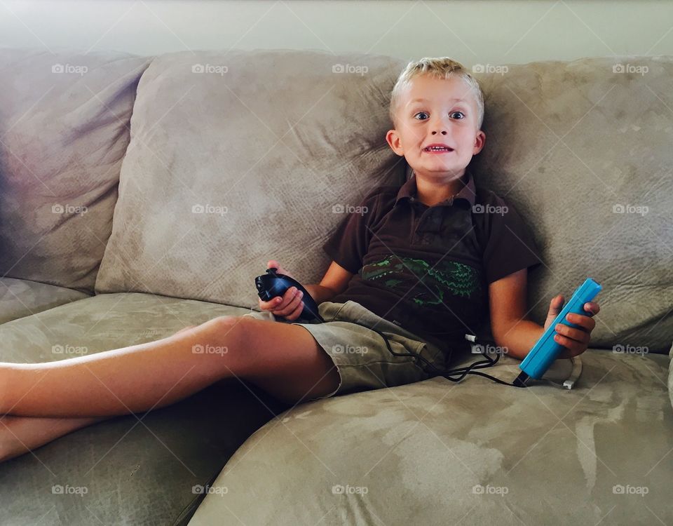 Little boy playing video games