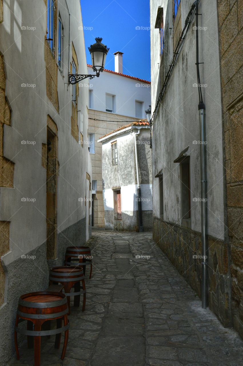 Barrel-shaped tables. Barrel-shaped tables outside a bar in Noia, Galicia, Spain