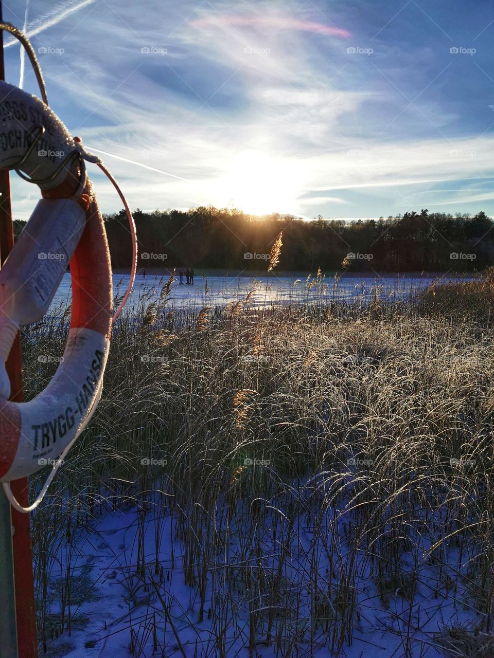 Sunset at icy lake