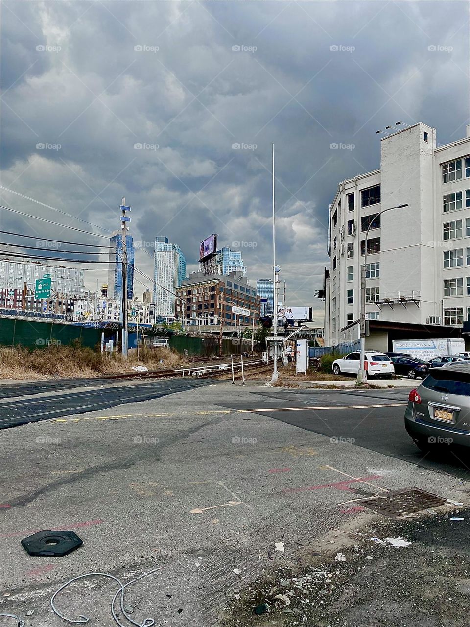 This is the “Long Island Railroad” crossing of “Borden Avenue” at “11th Street” by the “Pulaski Bridge” in LIC, Queens. When the red and white striped bar goes down all traffic is put on hold due to an upcoming train. 2023. Hypnotic Productions