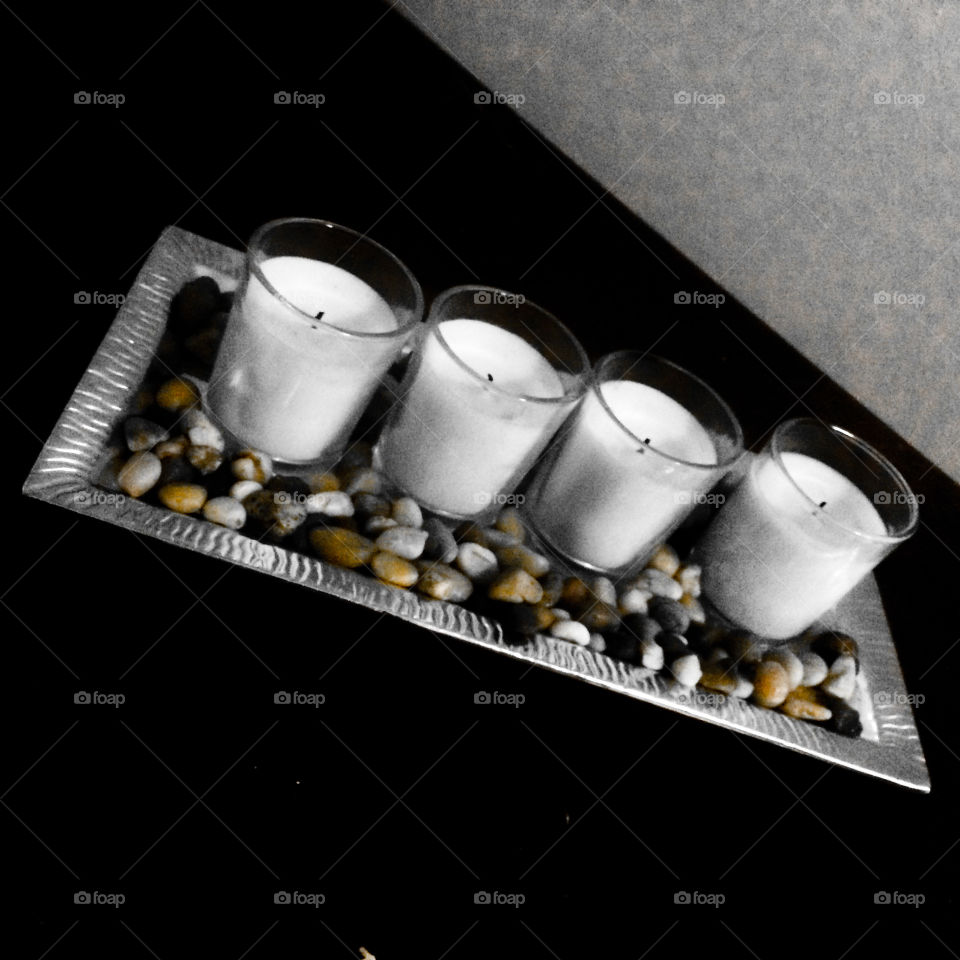 Candles with black and white background and color popped stones 