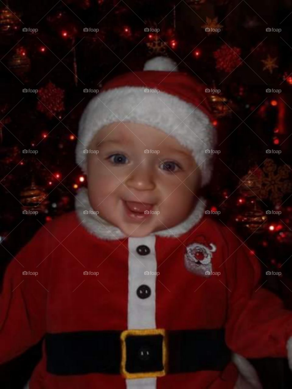 6 month old baby dressing as father Christmas 
 ( santa clause )