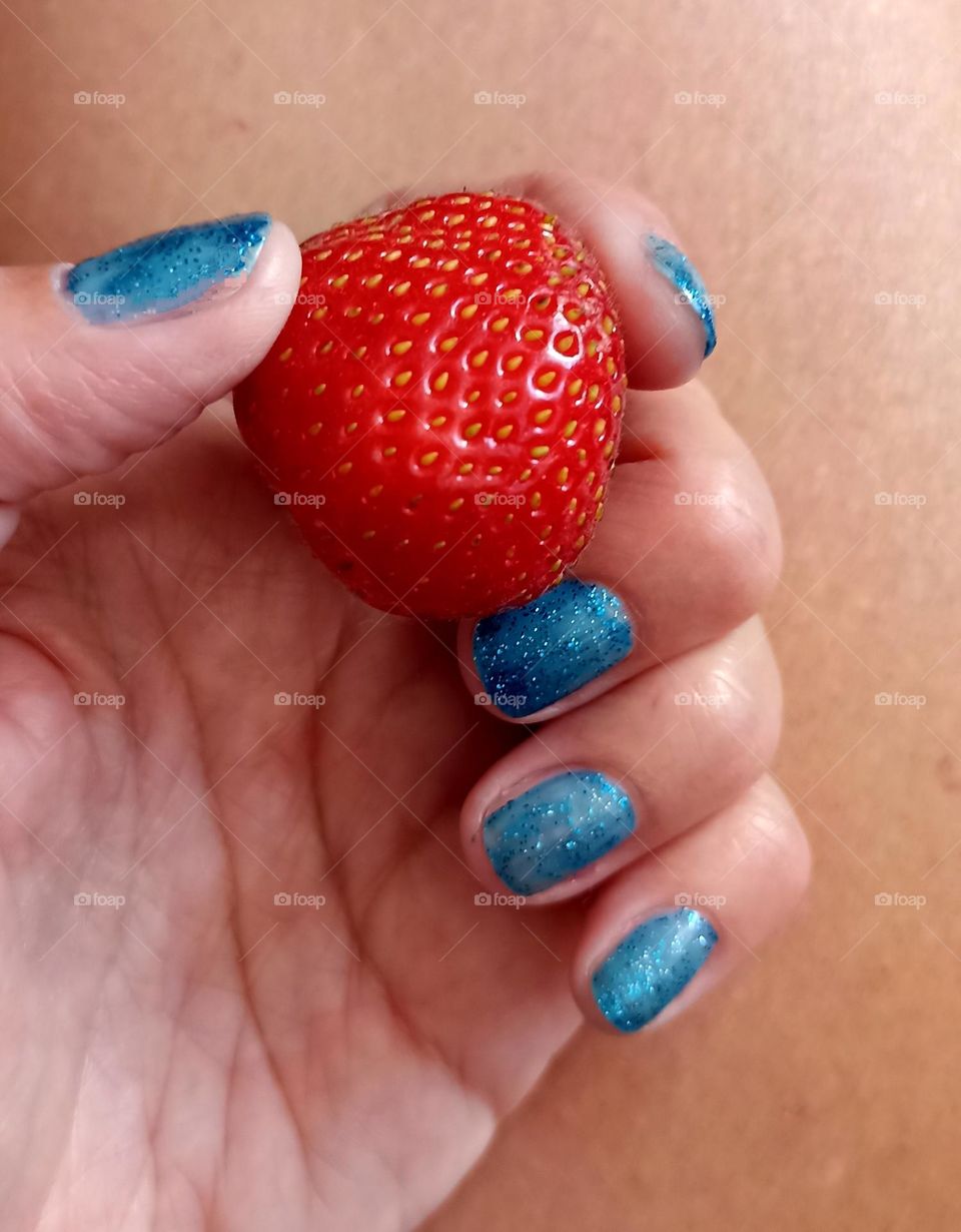 strawberry 🍓 in the female hand eating healthy food