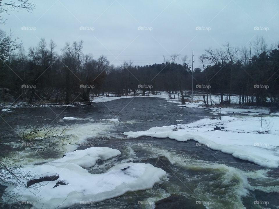 The Wolf River rapidly flowing through Keshena Falls in Menominee County and Indian Reservation near Keshena, Wisconsin.