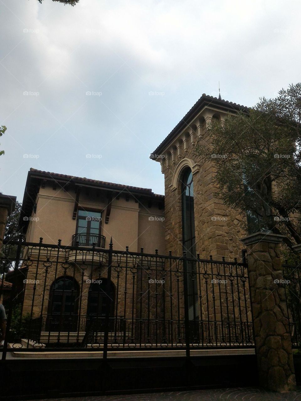 look at the main garage door the car entered. in the courtyard outside the stone house.