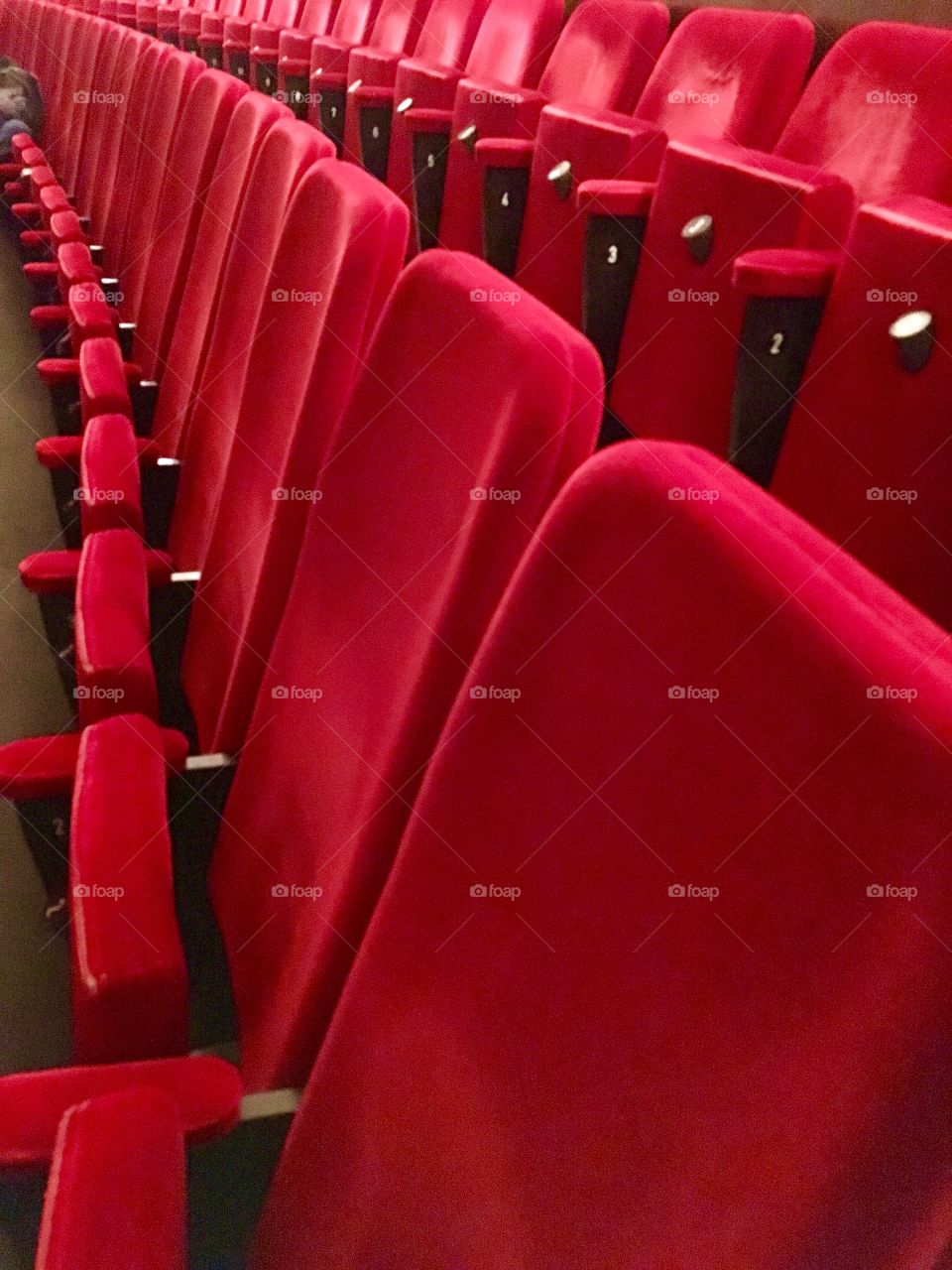 Red chairs in opera house