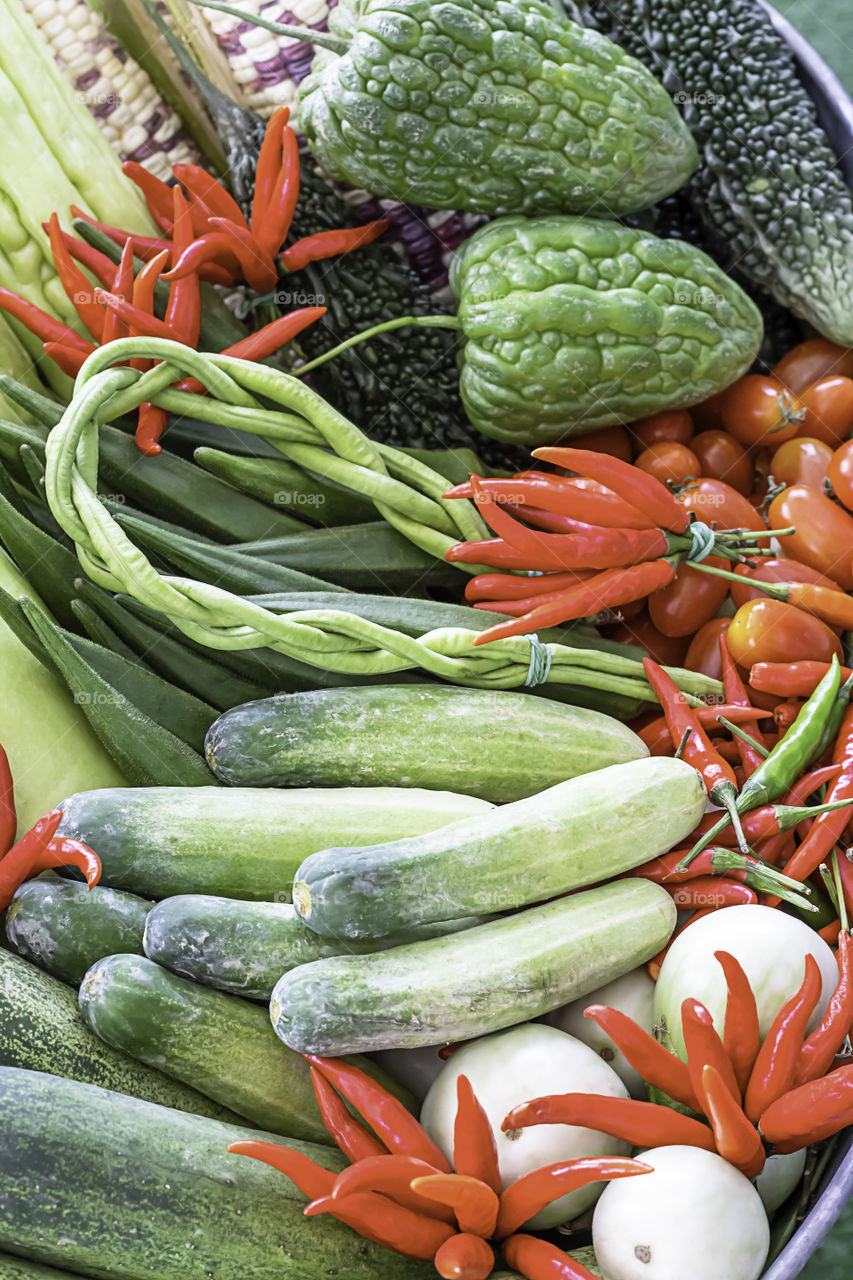 Vegetables in Thailand Cucumber , Tomato , Bitter gourd and red chilli.