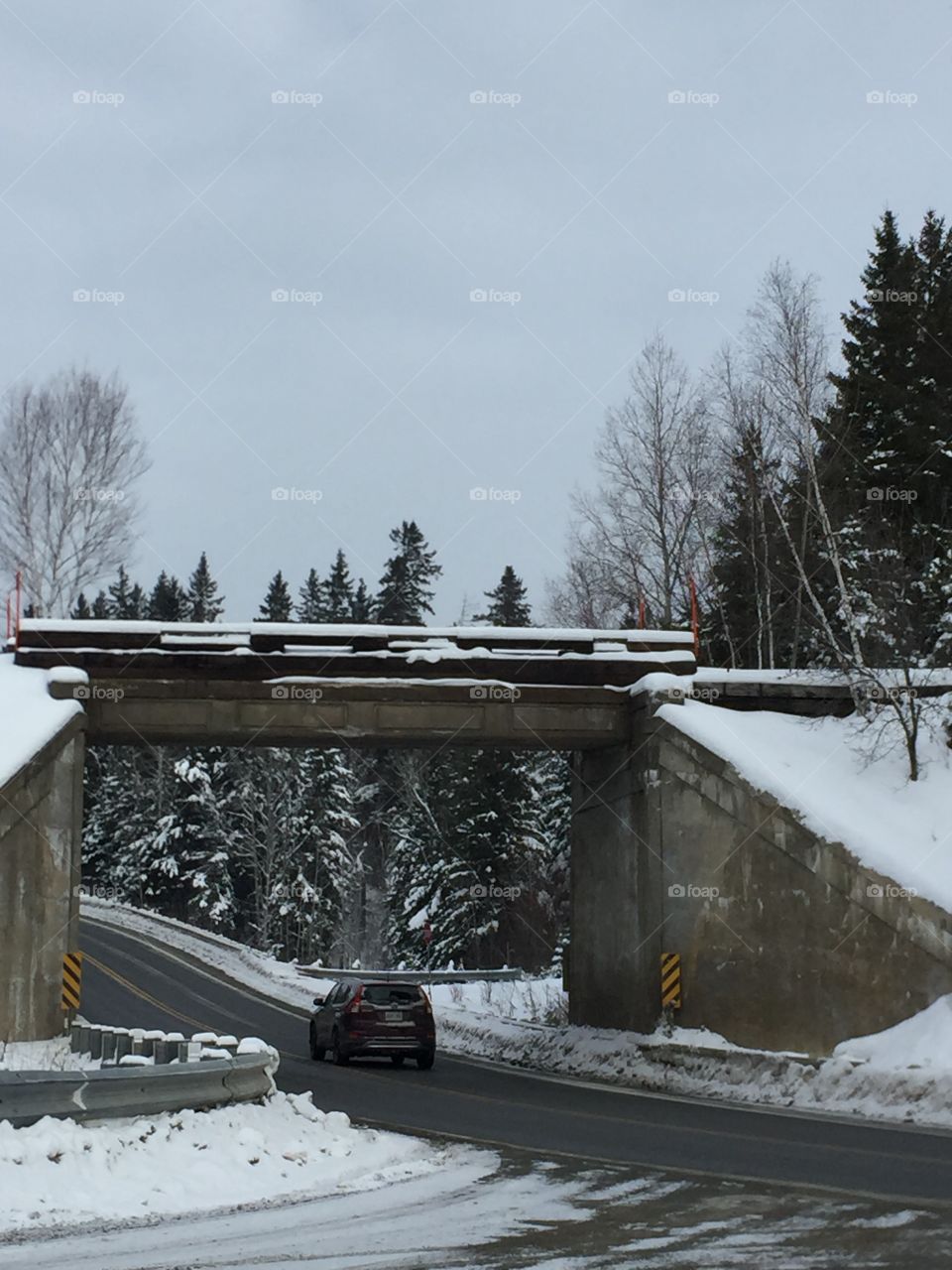 Railway bridge outside of Field Ontario on 64 hwy it’s interesting scene the road is on a bend .