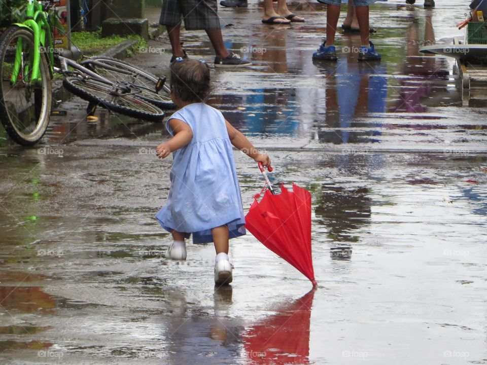 Little girl with red umbrella