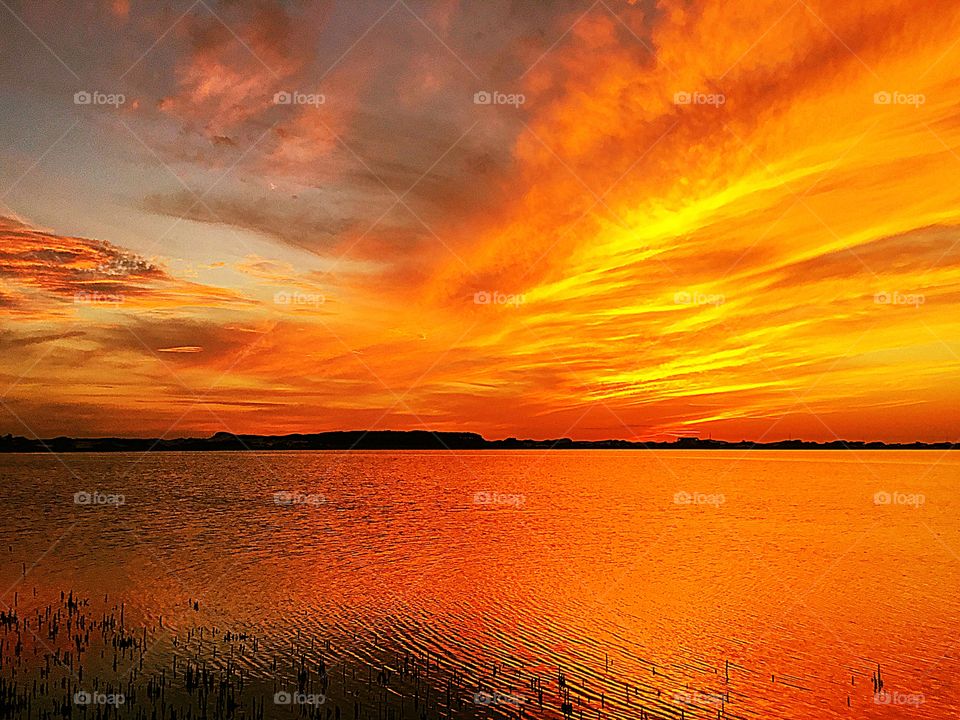 Magnificent sunset - The evening sunset was lighted up with a orange and red radiance, glorious to behold, and increasing every moment in splendor