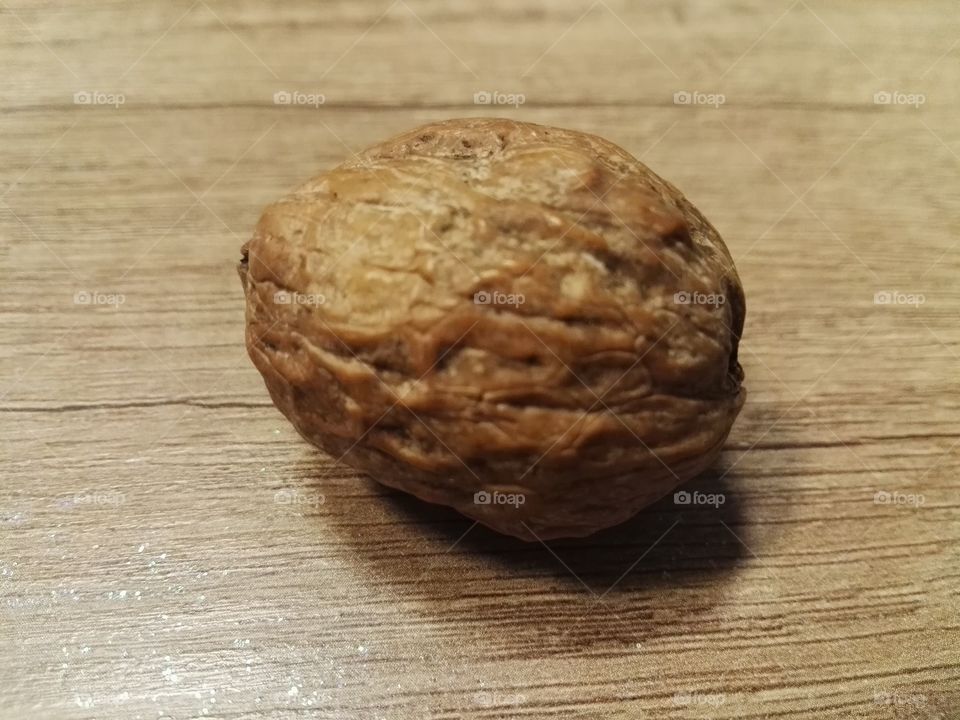 walnut on wooden table