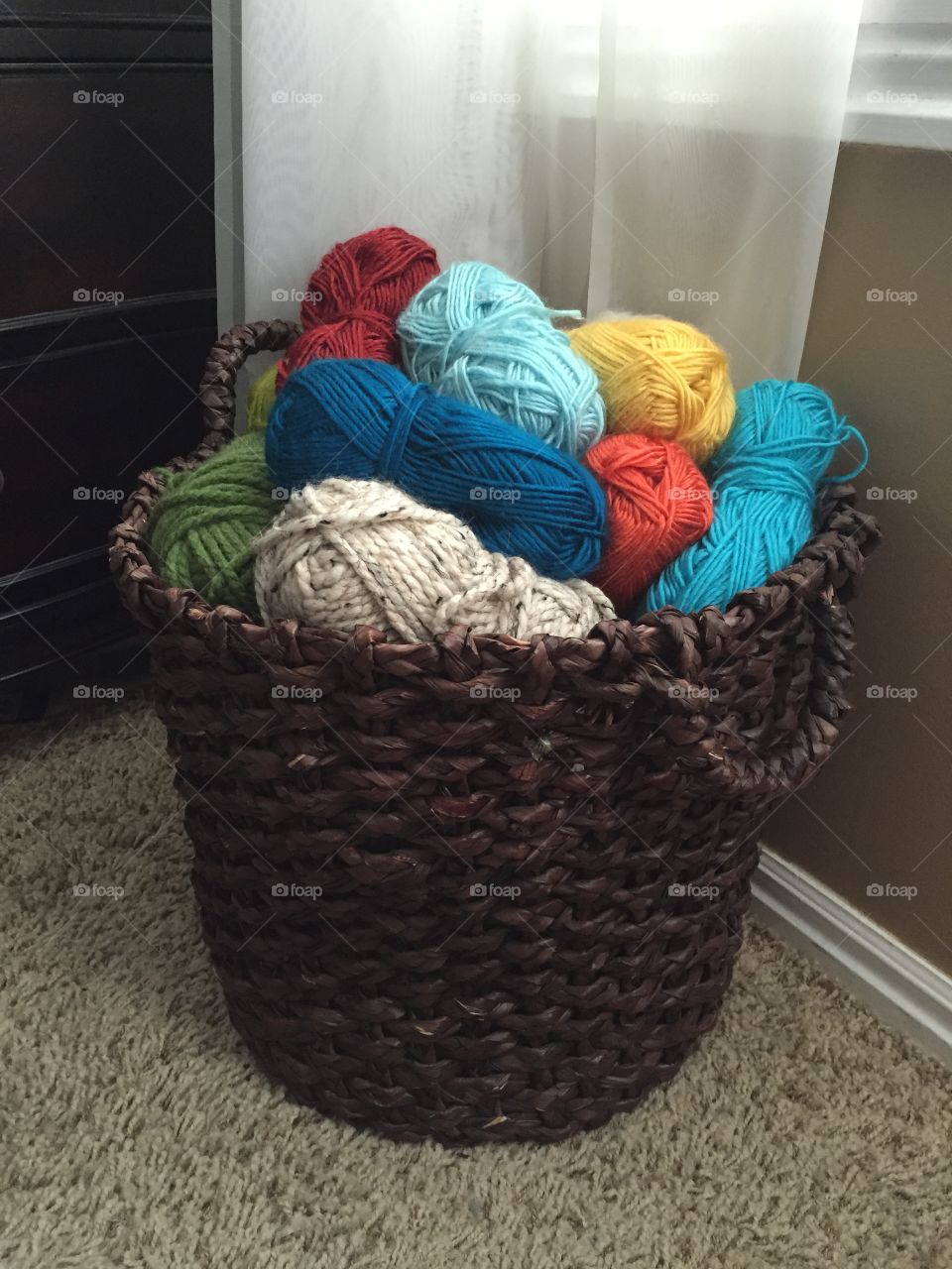 Basket full of yarn. A basket full of colorful yarn