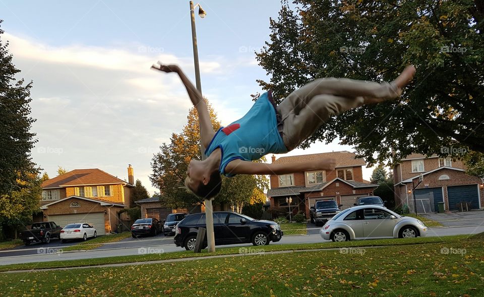 boy doing gymnastics in mid air